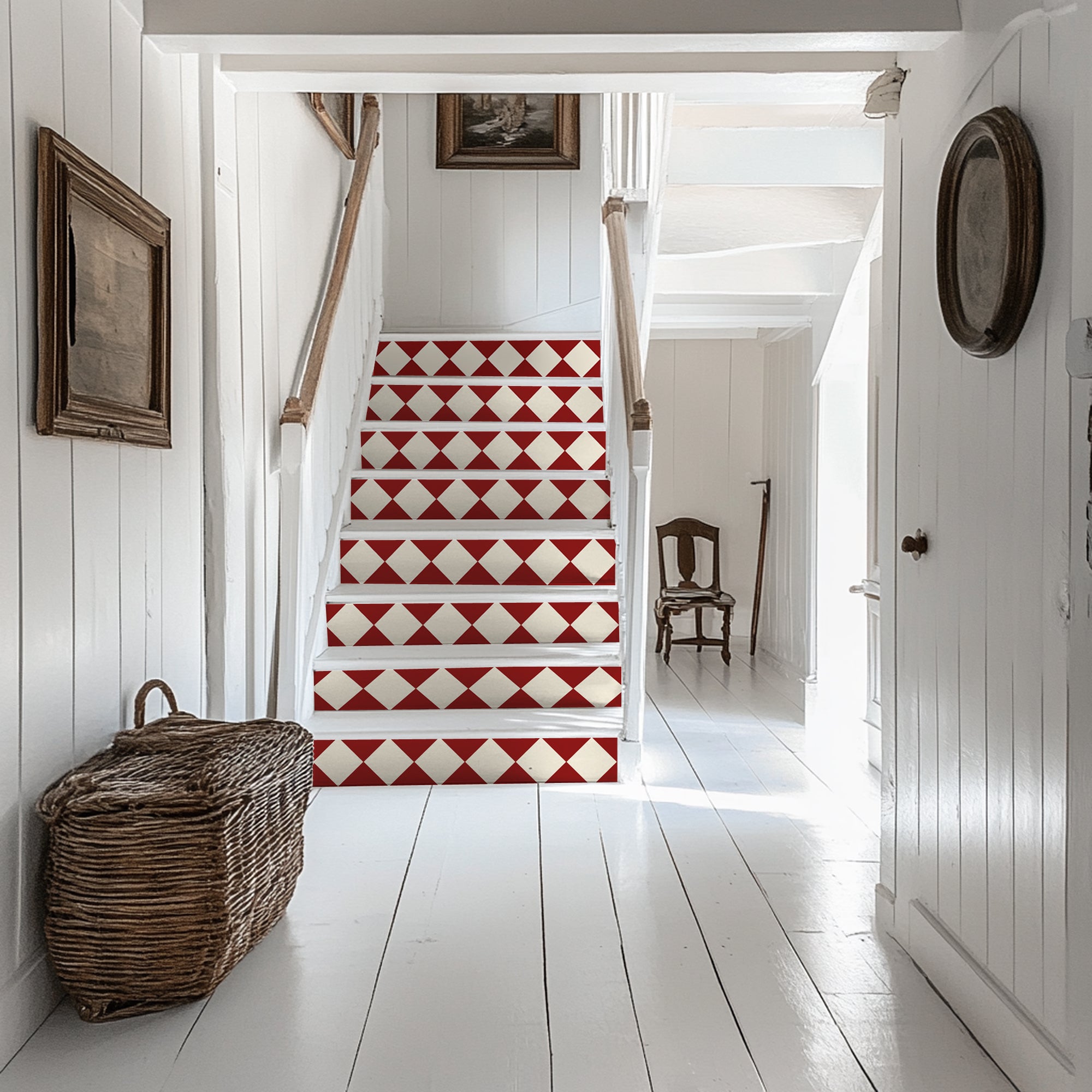 a white hallway with a red and white stair case