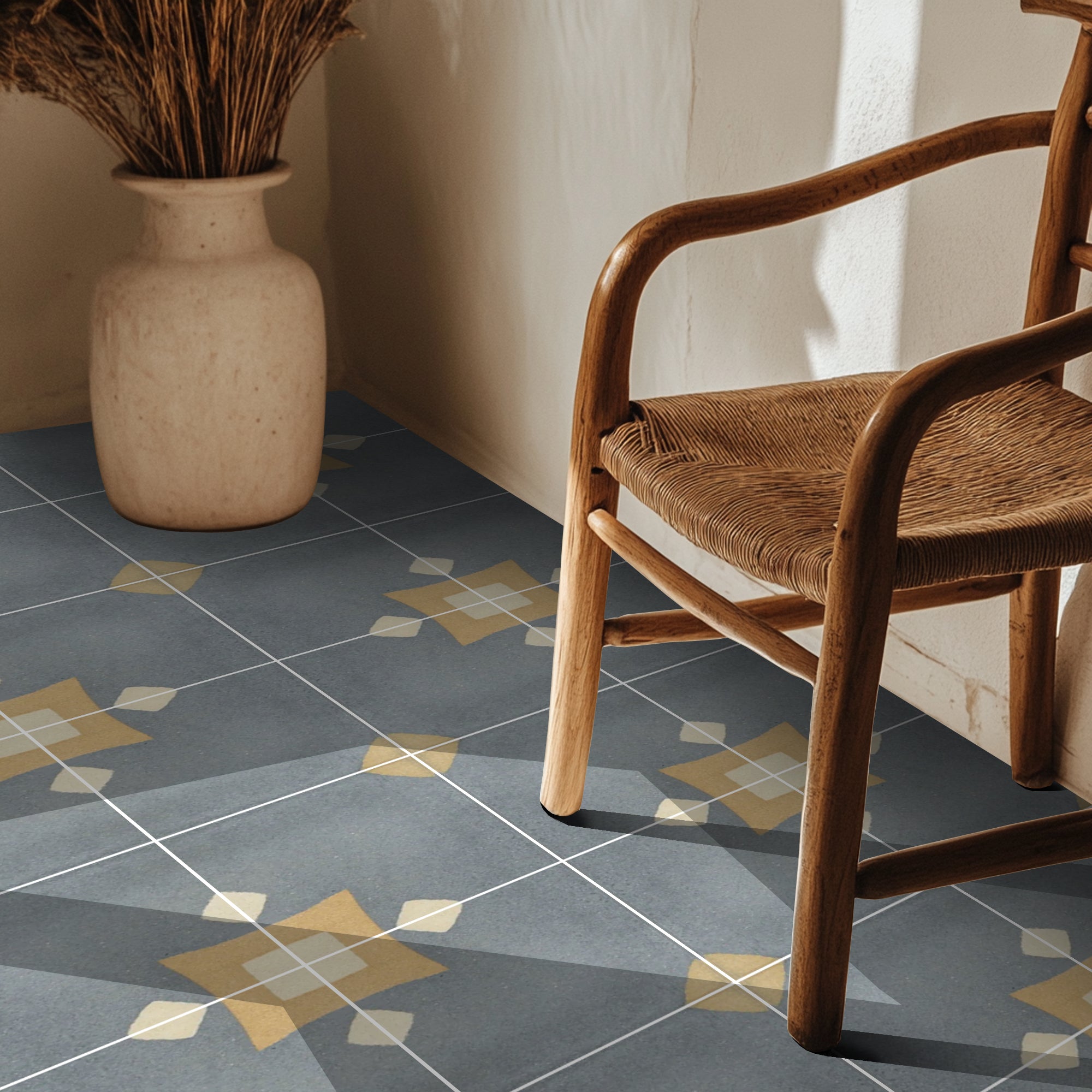 a chair and vase on a tiled floor