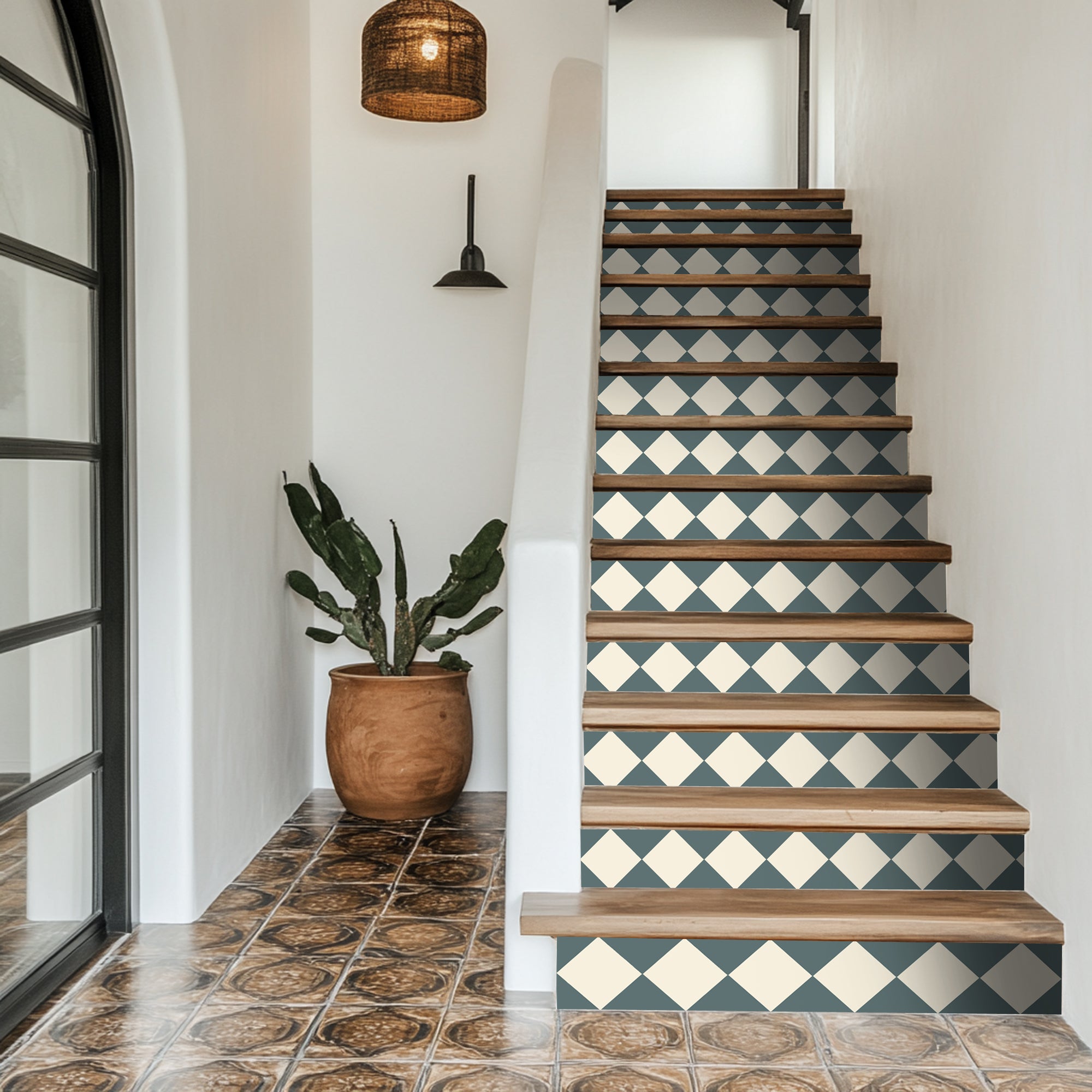a set of stairs with a potted plant next to it