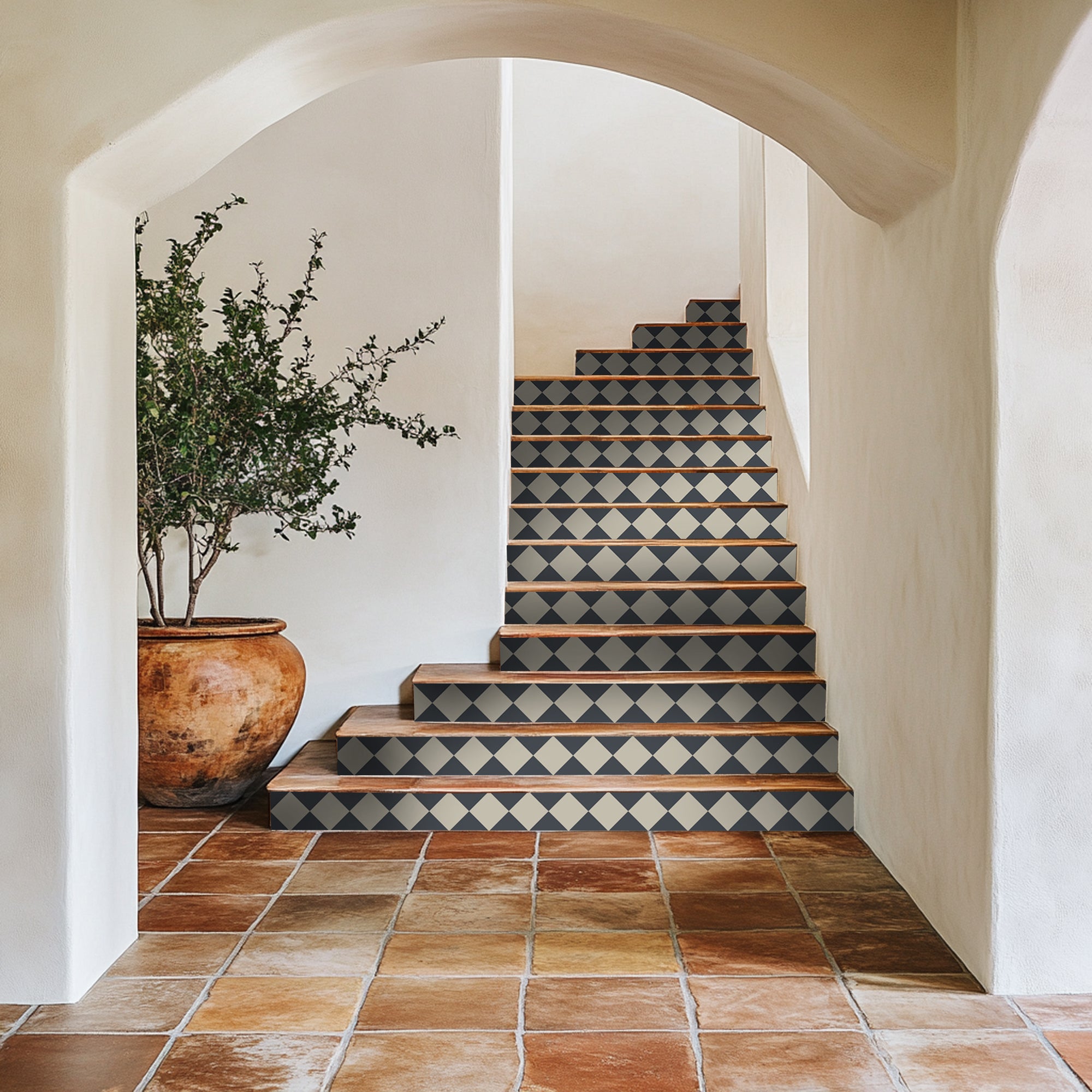 a potted plant sitting on top of a set of stairs