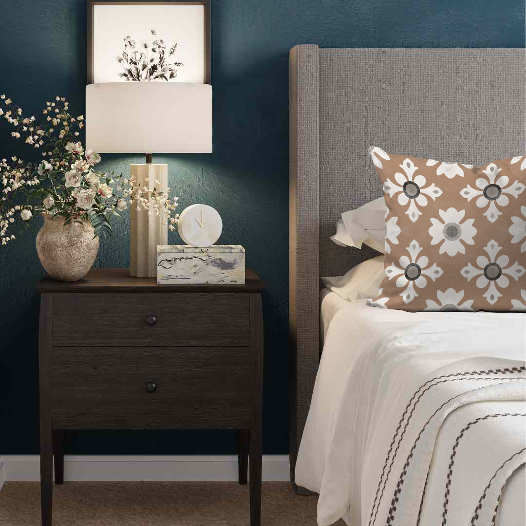 a bedroom with blue walls and a nightstand with flowers on it