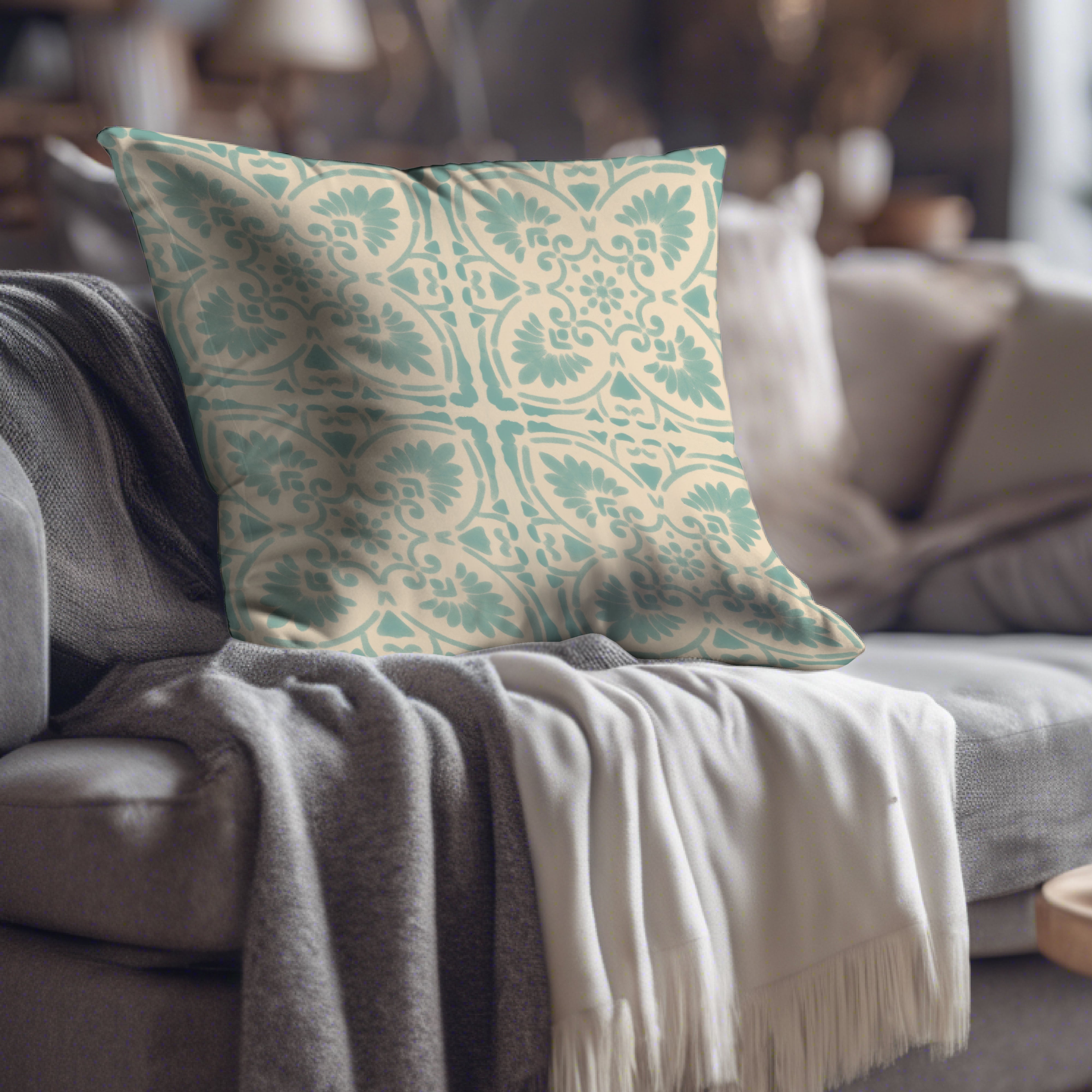 a couch with a throw pillow on top of it