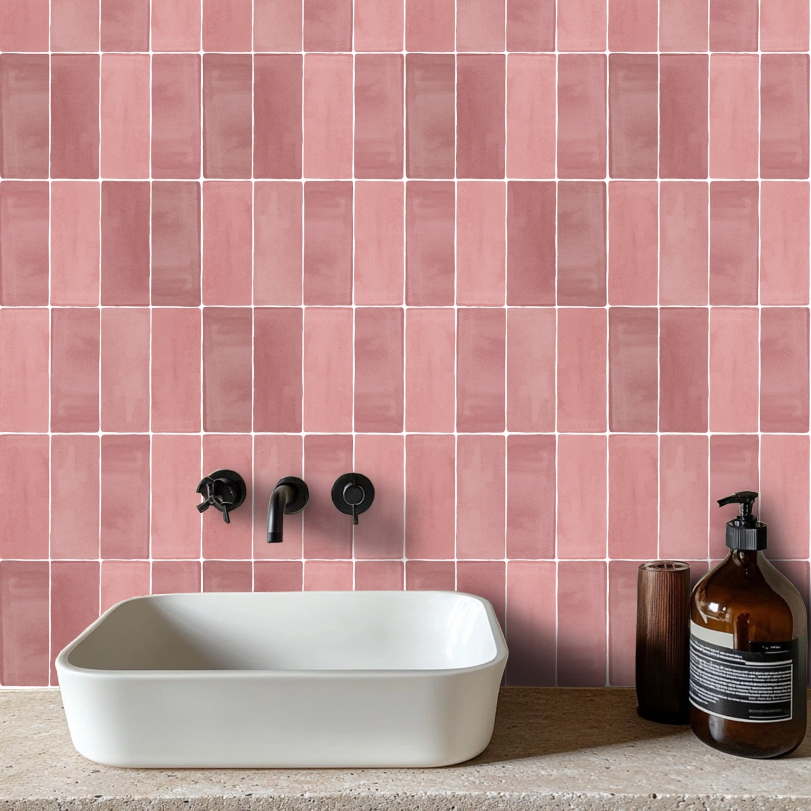 a white sink sitting next to a pink tiled wall