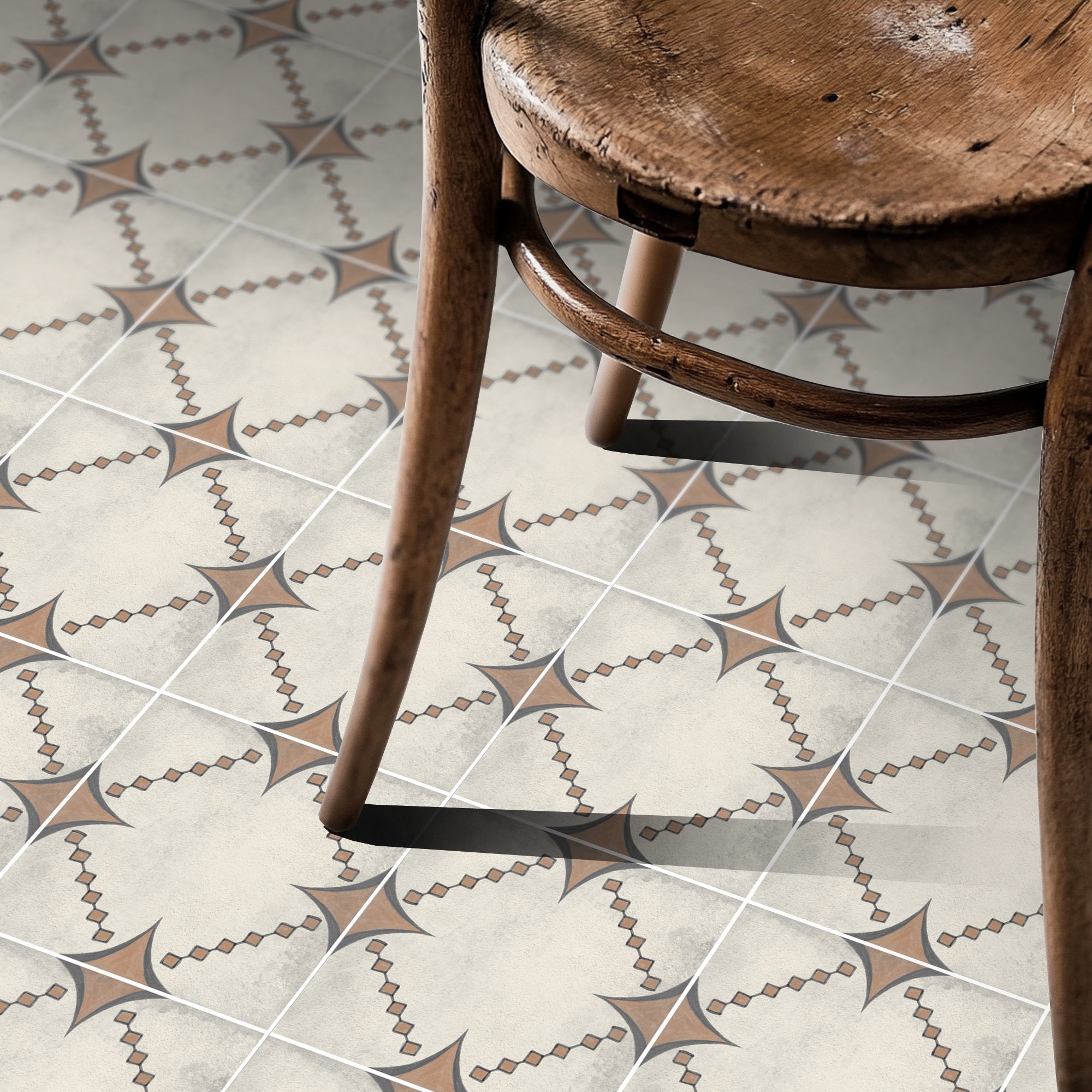 a wooden chair sitting on top of a tiled floor