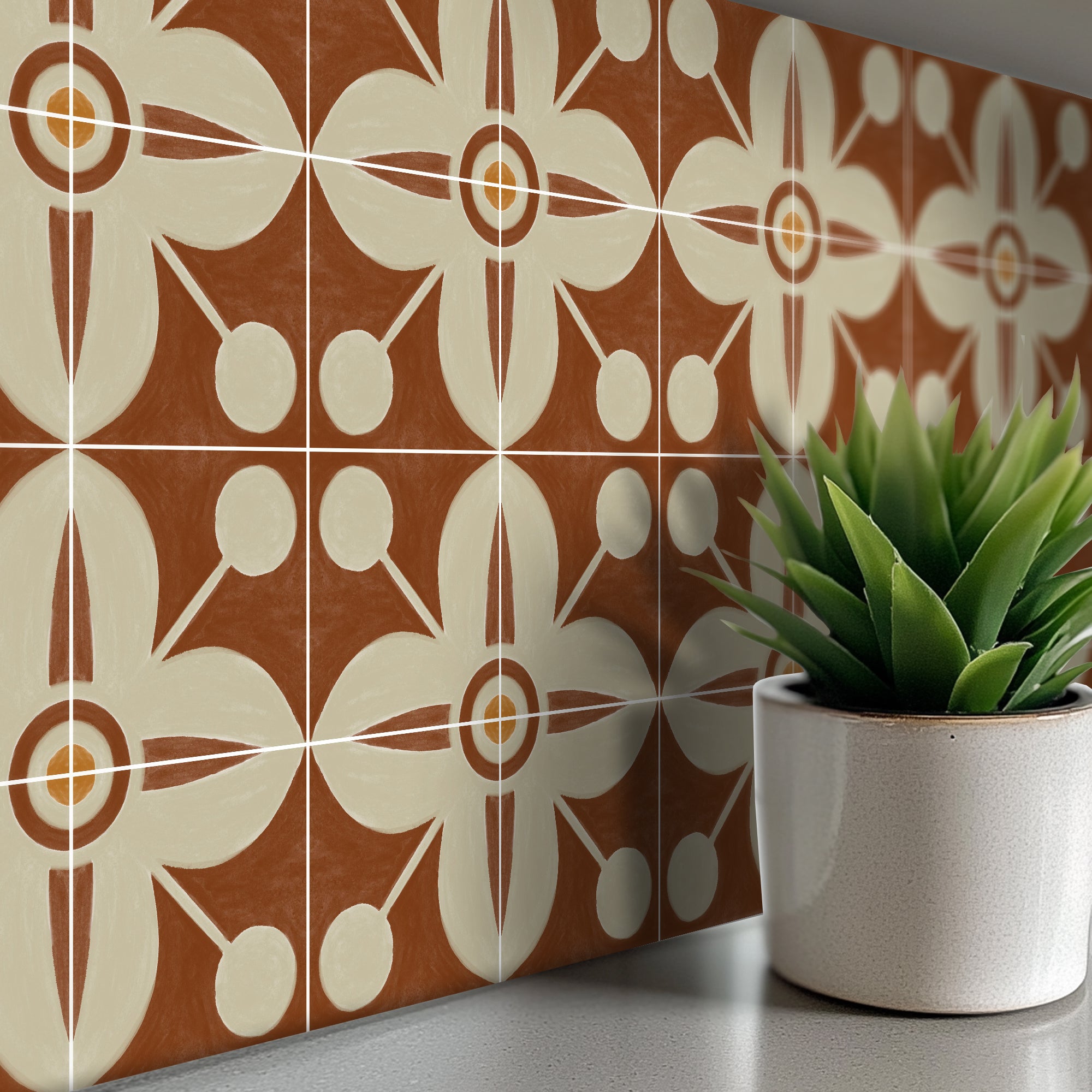 a potted plant sitting on a counter next to a tiled wall