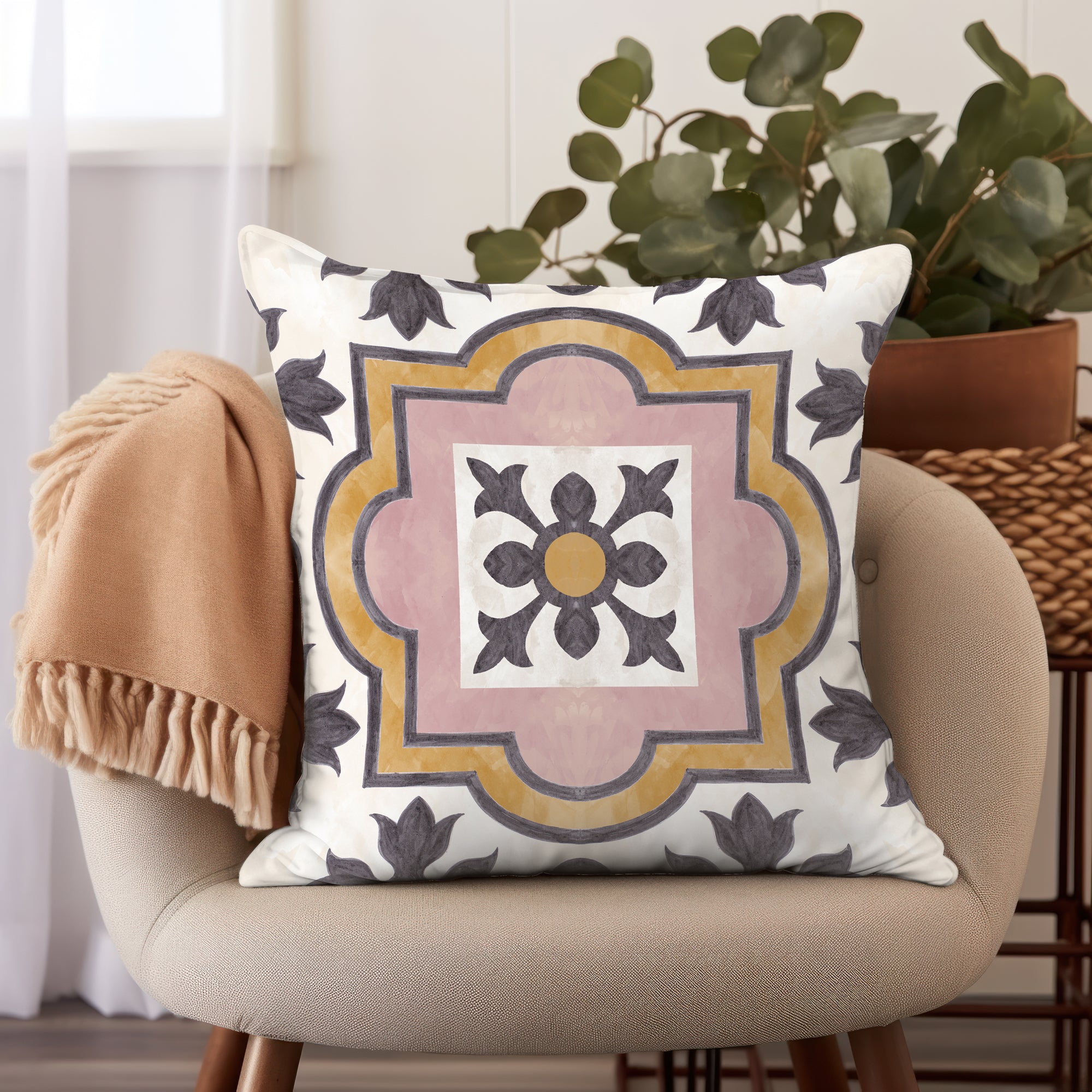 a decorative pillow on a chair with a plant in the background