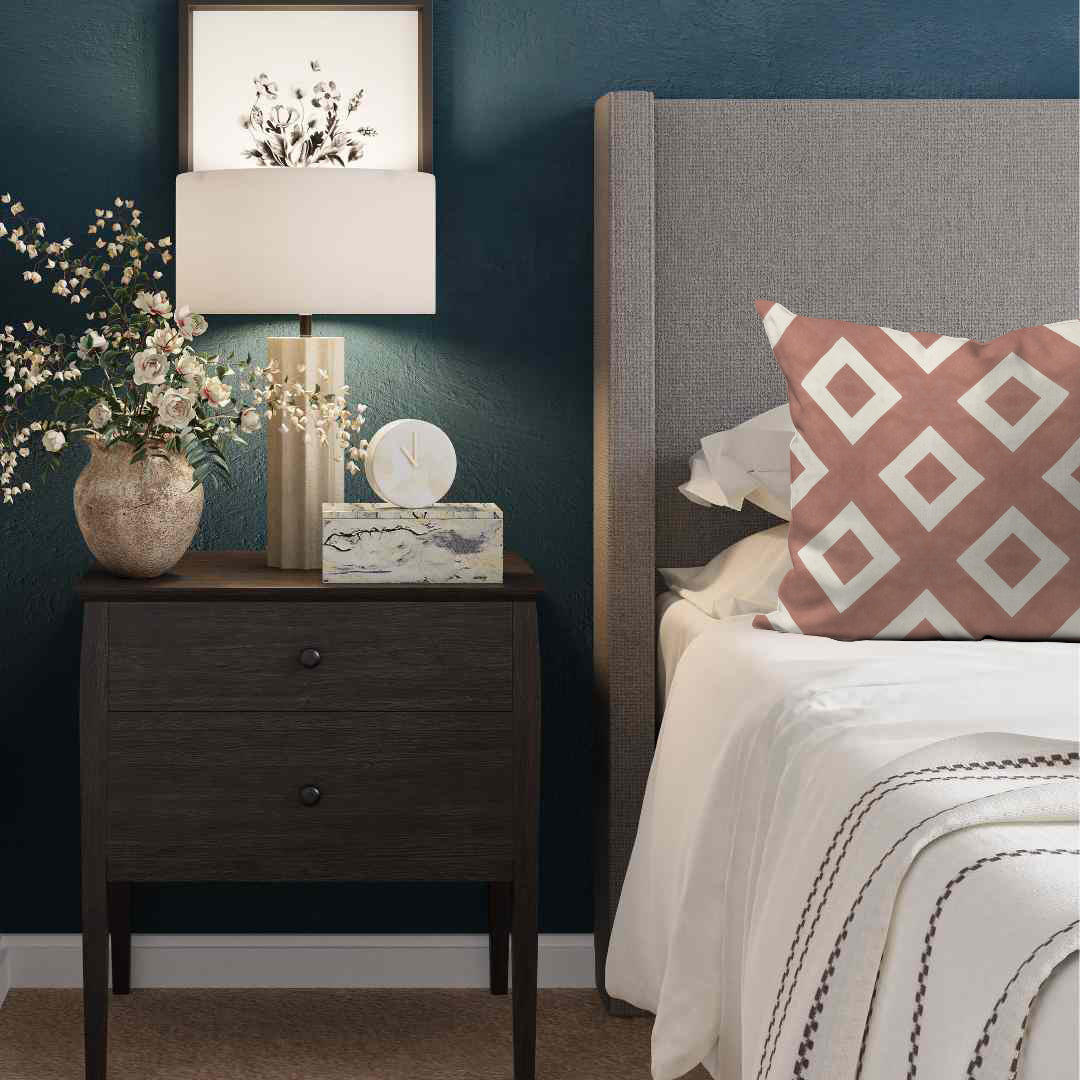 a bedroom with blue walls and a nightstand with flowers